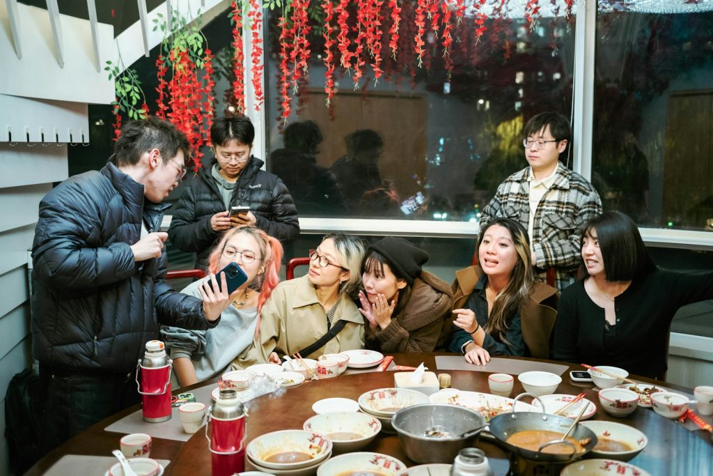 Group of friends gathered around a table for a meal